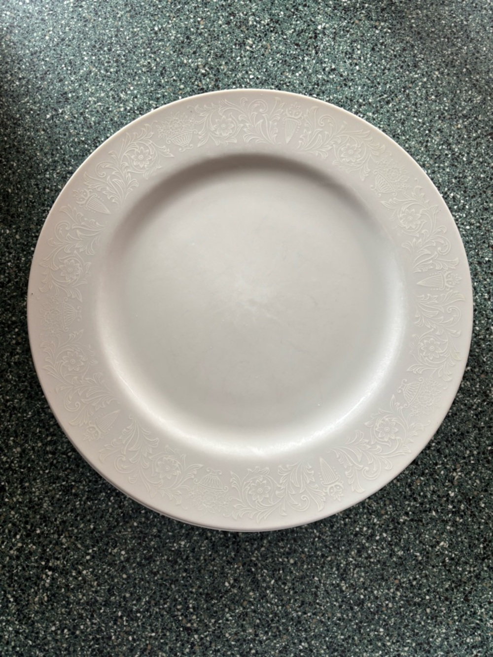 Set of 4 White on White Porcelain Dinner Plates with Floral Design. 10in x 10in.